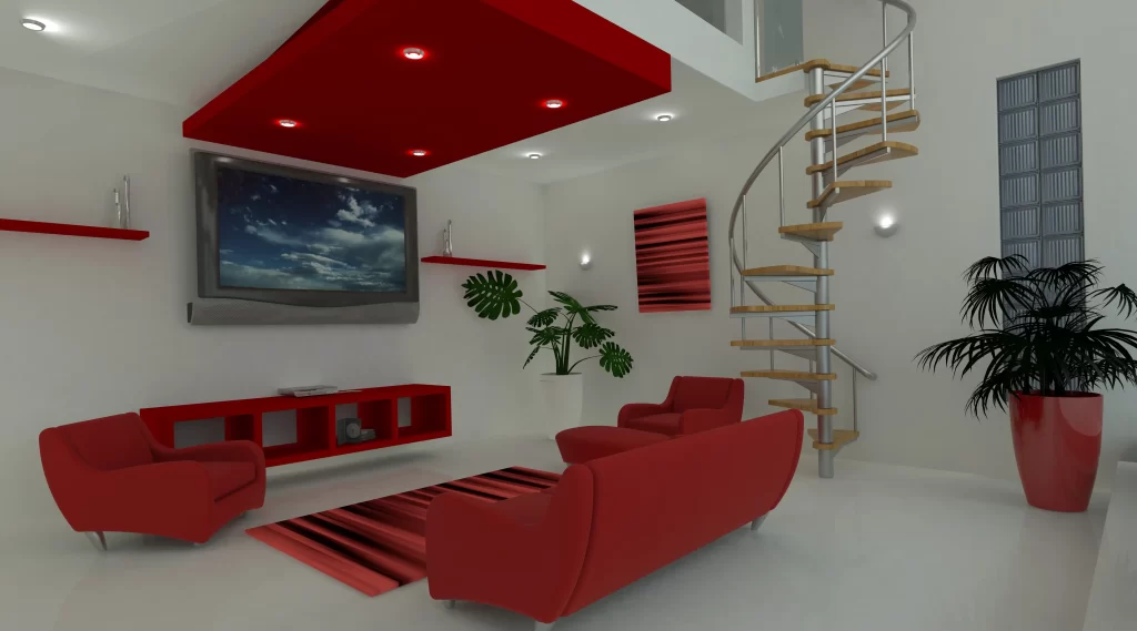 خانه ای که دکوراسیون آن قرمز میباشد و مبل ها در جلوی تلویزیون قرار دارد و تلویزیون به دیوار متصل شده است